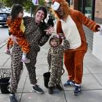 Mercer Island residents came out in droves to participate in trick-or-treating in Town Center on Oct. 25. The free, family-friendly city of Mercer Island event featured participating businesses handing out goodies. Here we have the Taing family of Caitlin, Rahul and youngsters Maya and Leo. Andy Nystrom/ staff photo