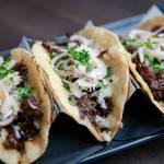 Bulgogi Tacos  thinly sliced ribeye marinated with kalbi sauce, melted cheese, pickled shallots, lime and cilantro. Photo courtesy of Jason Farrish