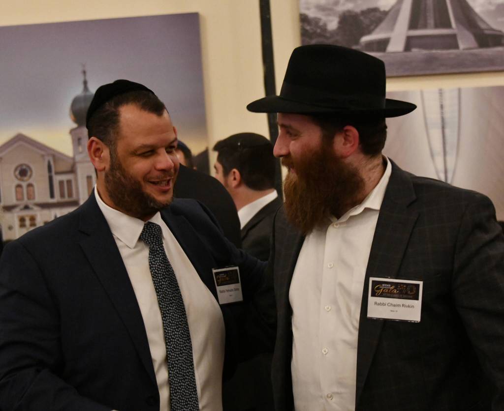 Northwest Yeshiva High School Head of School Rabbi Yehuda Gabay, left, speaks with Rabbi Chaim Rivkin at the gala. Andy Nystrom/ staff photo