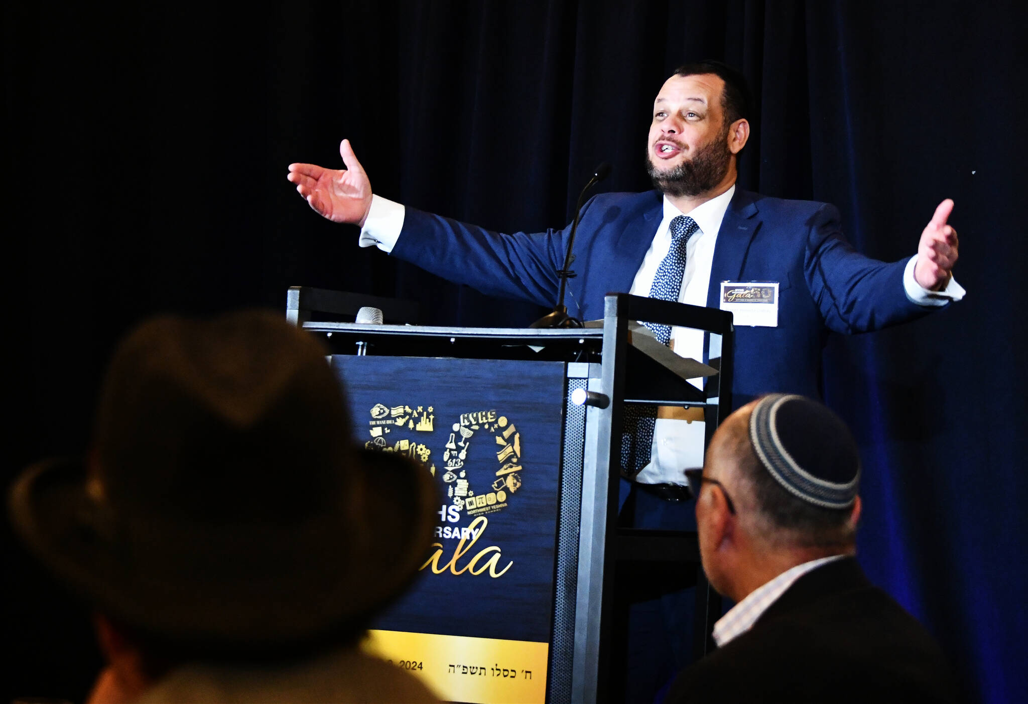 Northwest Yeshiva High School Head of School Rabbi Yehuda Gabay excitedly greets attendees at the schools 50th Anniversary Gala Dinner on Dec. 8 at the Island Synagogue. Andy Nystrom/ staff photo
