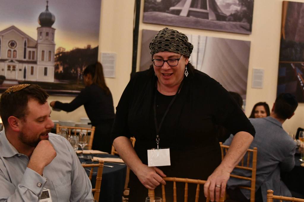 Northwest Yeshiva High School President Rachel Rosenfeld chats with an attendee at the gala. Andy Nystrom/ staff photo