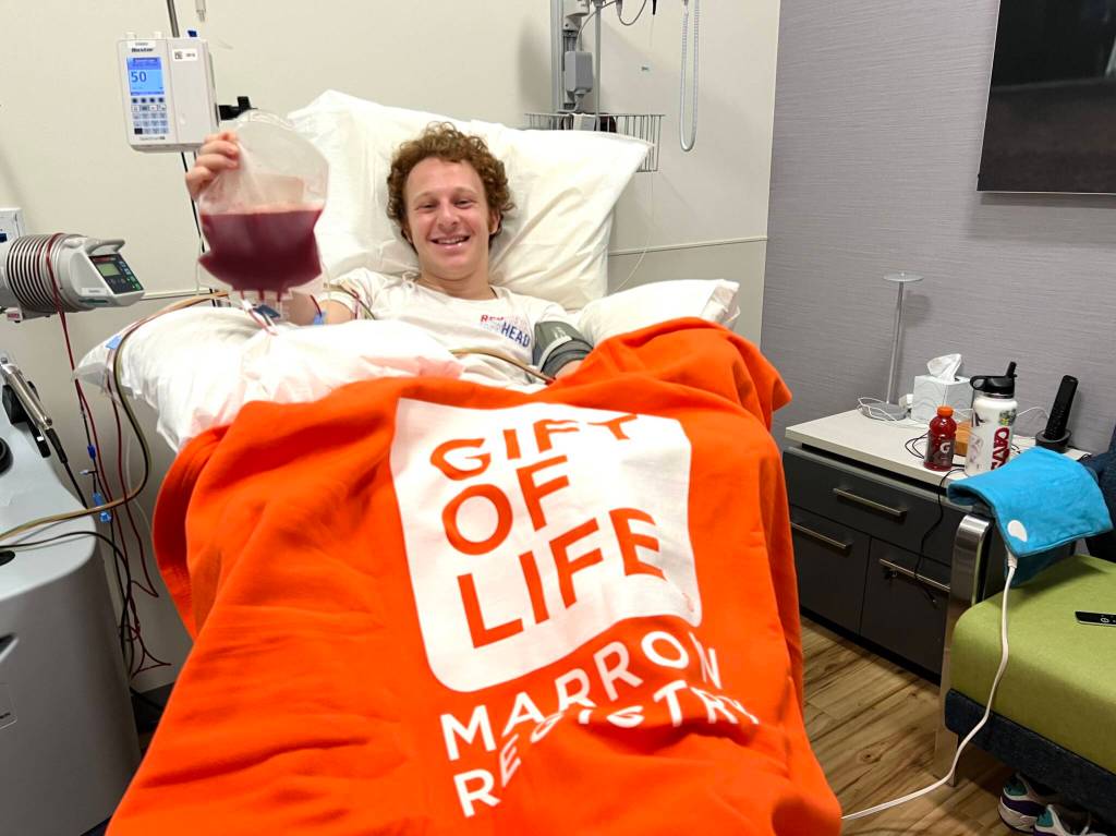 Mercer Islands David Wolf makes a stem cell donation at the NMDP Seattle Collection Center earlier this month. The donation was sent to aid a 24-year-old leukemia patient. Photo courtesy of Lisi Mezistrano Wolf