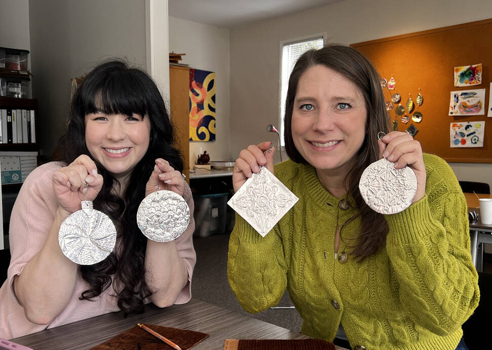 Community members Nicole Benson and Lynette Dufton enjoy a metal embossing class at MIVAL Studio. Photo courtesy of MIVAL
