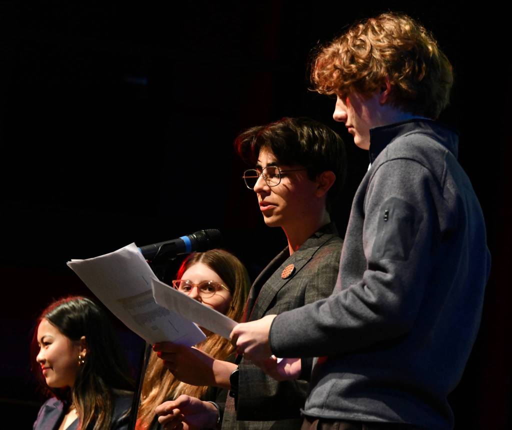 Mercer Island High School students Ava Zhang, Lucy Dorer, Julius Perez and Jon Anderson take the spotlight at the School Funding Crisis Eastside Town Hall. Andy Nystrom/ staff photo
