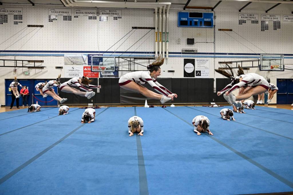 Mercer Island High School cheer team members perform some stellar jumps at a recent competition. Photo courtesy of Debbie Burke