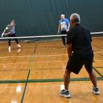 Pete Ng, bottom right, prepares to return the pickleball. Andy Nystrom/ staff photo