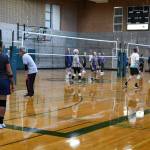 Bob Flagan, right, serves during a volleyball session. Andy Nystrom/ staff photo
