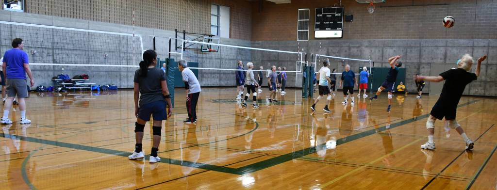 Bob Flagan, right, serves during a volleyball session. Andy Nystrom/ staff photo