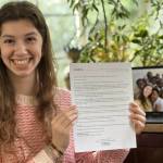 Mercer Island High School junior Savanna Rousell, PETRI vice president of scholarship correspondence, holds a letter of acceptance that went to a SeaVuria scholarship recipient. Photo courtesy of Savanna Rousell