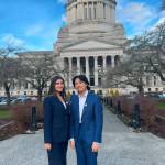 Mercer Island High School seniors Adelaide Swenson and Anthony Wang stand outside the Legislative Building in Olympia on Feb. 7. Courtesy photo