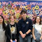 On Feb. 4, the Mercer Island High Schools S.A.F.E. Club hosted the I DONUT drive impaired event in conjunction with the Youth and Family Services MI Healthy Youth Initiative. During the lunch hour, MIHS students were invited to sign a pledge stating that they would not drive a car or ride in a car with someone who was impaired by alcohol, cannabis or other substances. After signing the pledge, students received a Krispy Kreme donut. Over 700 donuts were distributed at the event. 
Photos courtesy of Michelle Ritter