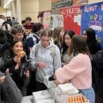 On Feb. 4, the Mercer Island High Schools S.A.F.E. Club hosted the I DONUT drive impaired event in conjunction with the Youth and Family Services MI Healthy Youth Initiative. During the lunch hour, MIHS students were invited to sign a pledge stating that they would not drive a car or ride in a car with someone who was impaired by alcohol, cannabis or other substances. After signing the pledge, students received a Krispy Kreme donut. Over 700 donuts were distributed at the event. 
Photos courtesy of Michelle Ritter