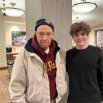 Mercer Island High School sophomore Sean Barneson visits with Howard (Howie) L. Fink, 89, at Aegis Living Mercer Island. Photo courtesy of Colleen Barneson