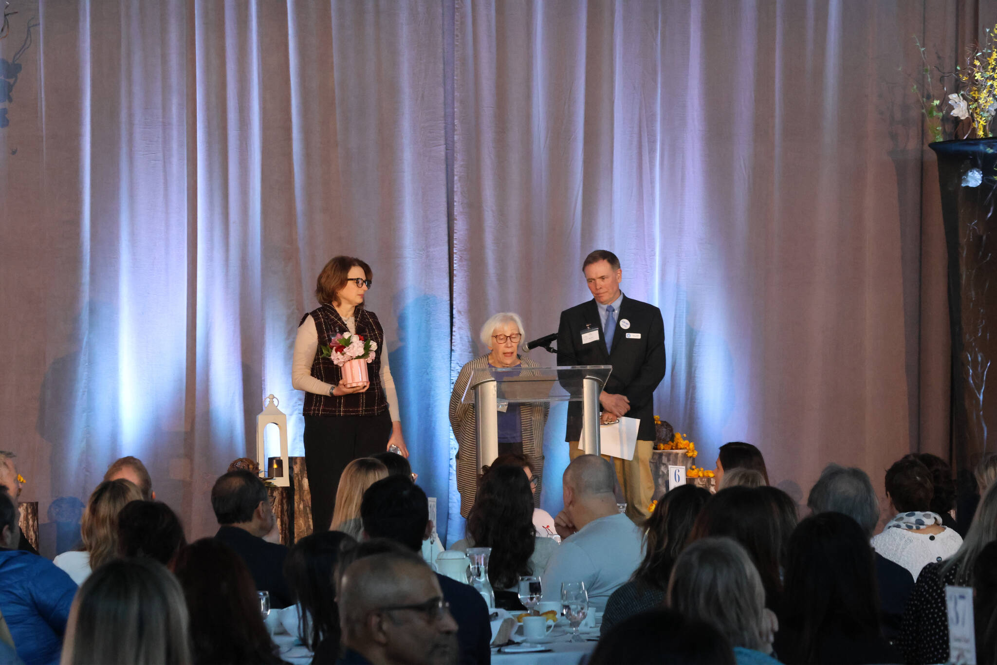 Mercer Island Youth and Family Services (MIYFS) Administrator Derek Franklin and MIYFS Foundation Executive Director Amy French with Carin Mack, who received the 2025 Philanthropy Award. Photo courtesy of Steve Sogge