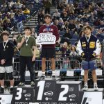 Mercer Island High Schools Chase Warnick stands atop the wrestling podium at state. Photo courtesy of Colton Knebel