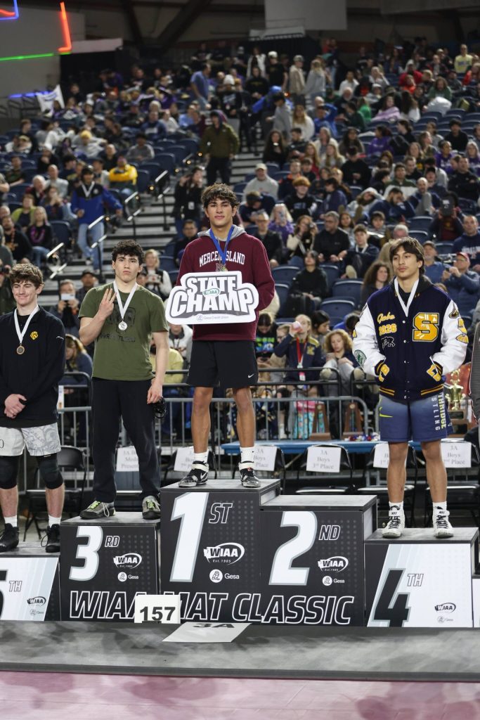 Mercer Island High Schools Chase Warnick stands atop the wrestling podium at state. Photo courtesy of Colton Knebel