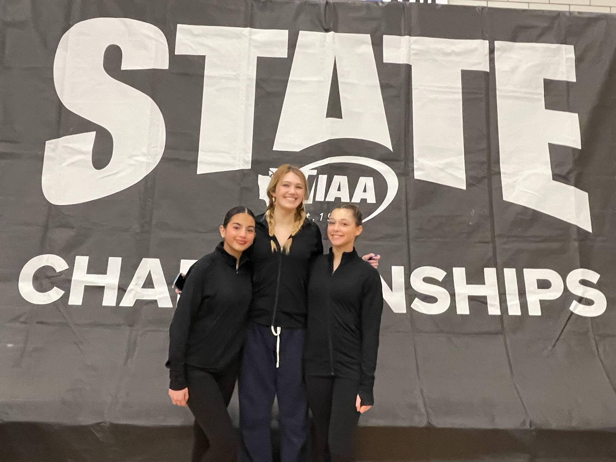 Mercer Island High School gymnasts, from left to right, Manuela Mendoza Cajiao, Maya Moncaster and Rainey Rosenwald, competed at the 3A state championships on Feb. 20-21 at Sammamish High School in Bellevue. Sophomore Rosenwald competed in the all-around (33.45, 29th) with individual scores on the vault (8.025, 63rd), bars (8.15, tied for 21st), beam (8.125, tied for 36th) and floor (9.15, tied for 28th); freshman Mendoza Cajiao competed on the vault (7.5, 83rd); and junior Moncaster  a second-year state qualifier  competed on the vault (7.75, tied for 75th), bars (7.425, 49th) and beam (6.6, tied for 87th). Courtesy photo