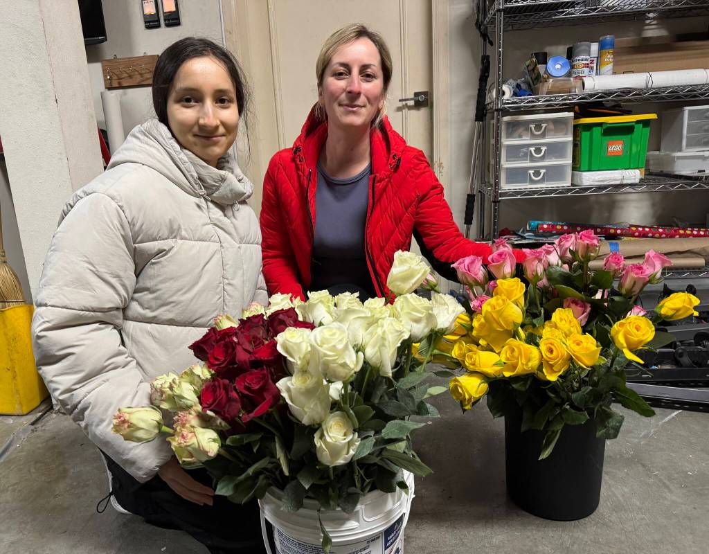 Sabrina Ennanova and her mom Zarema Kharachik organize and sort roses for seniors. Courtesy photo