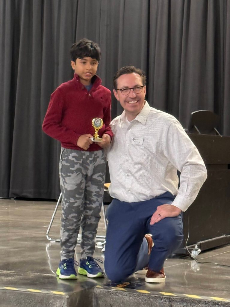 Adrit Pradeepkumar, Reflections Program Primary Music Composition winner, with Mercer Island School District Superintendent Fred Rundle. Pradeepkumar is the Outstanding Interpretation winner at the statewide level and is headed to nationals. He was one of numerous local winners. Photo courtesy of Julie Hsieh