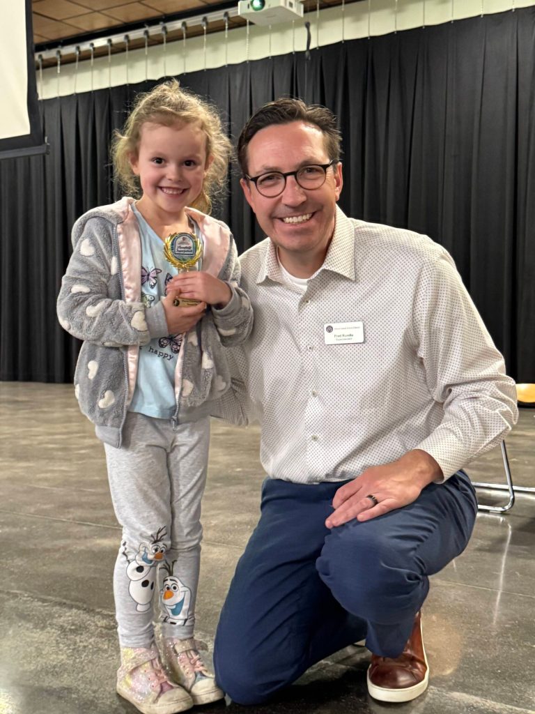 Skylar Vannatter, Reflections Program Pre-Primary Dance Choreography winner, with Mercer Island School District Superintendent Fred Rundle. She was one of many local winners. Photo courtesy of Julie Hsieh