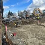 OMA Construction workers make headway on March 18 at the Town Center Parking Area at the former Tullys site. Andy Nystrom/ staff photo