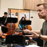 Mercer Island High School orchestra director Bryan Kolk leads the way during a recent class. Andy Nystrom/ staff photo