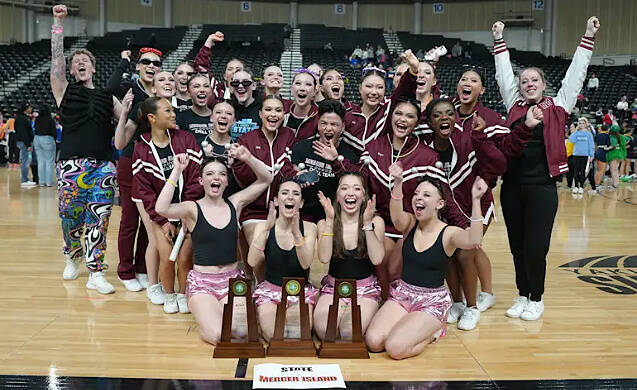 The Mercer Island High School drill team celebrates its three state championships at the Yakima SunDome on March 28. Photo courtesy of the Mercer Island School District