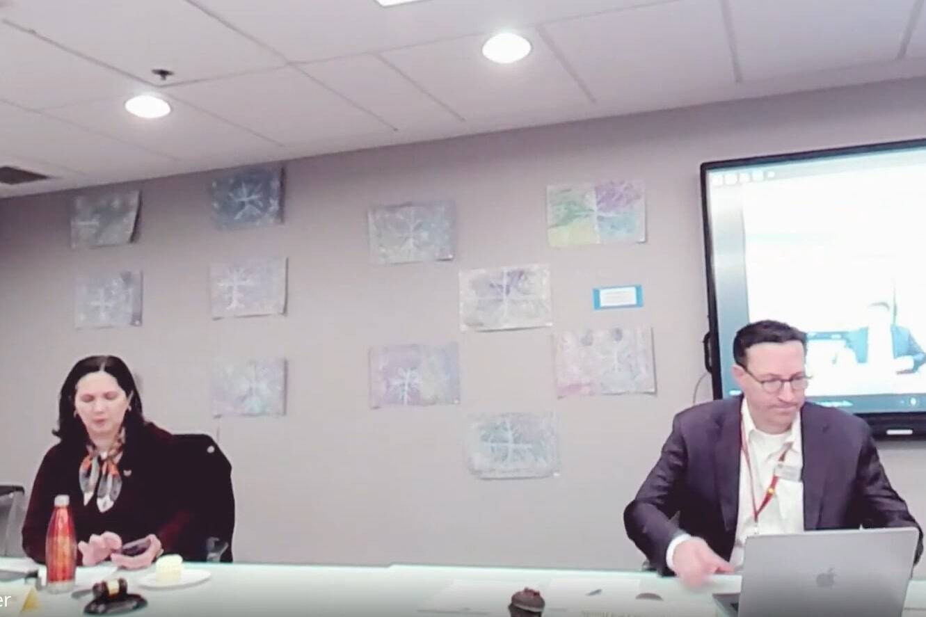 Mercer Island School Board President Maggie Tai Tucker, left, and Superintendent Fred Rundle at the March 27 meeting. (Screenshot from YouTube video)