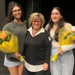 From left to right, Anusha Zaveri, Tami Brooks and Maya Talby gather at the Mercer Island High School sexual assault awareness assembly on March 19. Photo courtesy of the Mercer Island School District