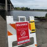 One of the signs the city posted at Mercer Island beaches and public beach access areas regarding Lake Washington water possibly being contaminated with sewage. Photo courtesy of the city of Mercer Island