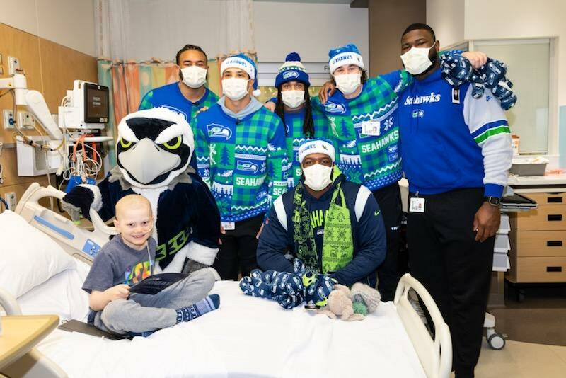 Emerson Vivion visits with the Seattle Seahawks crew. (Photo courtesy of the Seattle Seahawks)