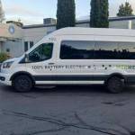 An electric shuttle bus is parked at the Mercer Island City Hall/Public Works campus. Photo courtesy of Swoop