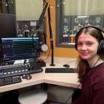 Paloma Lola Melian Lafinur sits in the KMIH 88.9 The Bridge studio where she was interviewed about her New York Times Tiny Memoir Contest honorable mention award. She read her memoir, Mi Nombre, on both The Bridge and on The Current on MIHS.tv. Photo courtesy of the Mercer Island School District