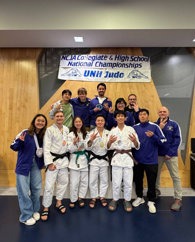 Tegan Yuasa, bottom row center, gathers with his University of Washington judo team at the national collegiate championships. Courtesy photo