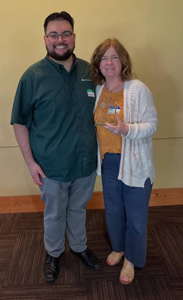Mercer Island School District Capital Projects Coordinator Kathy Zurawski with Diego Rojas, an energy management engineer from Puget Sound Energy (PSE) who works with the district as part of PSEs Commercial Strategic Energy Management program. The districts goal is to reduce its energy consumption by 3% to 5% each year. Photo courtesy of the Mercer Island School District