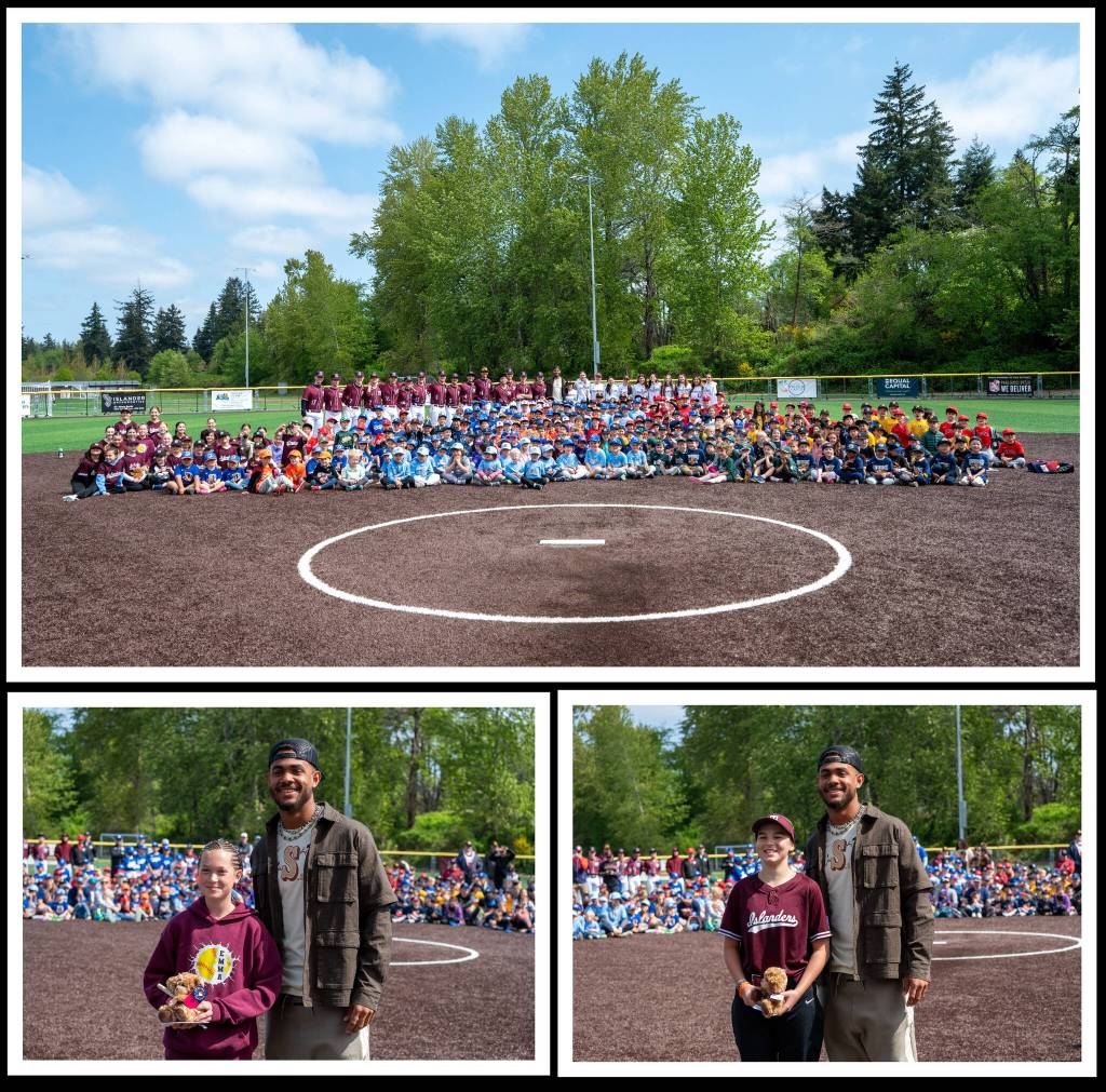 Seattle Mariners center fielder Julio Rodriguez made a surprise visit at the Mercer Island Little League 20th anniversary opening day celebration on April 26 at South Mercer Baseball Fields. Heres J-Rod pictured with home run derby winners Emma Christofferson (left) from Coast Softball, and Molly Sorensen (right) from Majors Softball. Other home run derby winners were: Majors Baseball: Brooks Roodman, Phillies; Coast Baseball: Maverick McLear, Angels; Coast Softball: Maroon Monsoon; AAA Baseball: Ben Schmies, Reds (and kudos to runner up Rollie Engel after a three-round tiebreaker); and AAA Softball (tie): Wyatt Allison and Gianna Besecker. There was also an annual parade of teams and a welcome address from President Jessica Rudolf and encouraging words from J-Rod. Courtesy photos