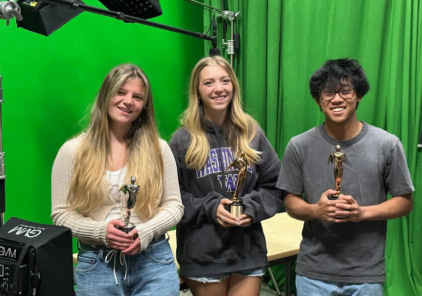 Left to right: Hannah Moeller, Hadley Holtzclaw and Minh Luu hold their Telly Awards in the MIHS.tv studio. Photo courtesy of the Mercer Island School District