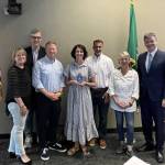 Mercer Islands 2024 Community Member of the Year Jennifer Goodrich, center, gathers with Mercer Island City Councils Wendy Weiker, Craig Reynolds, Deputy Mayor David Rosenbaum, Mayor Salim Nice, Lisa Anderl and Ted Weinberg. Photo courtesy of the city of Mercer Island
