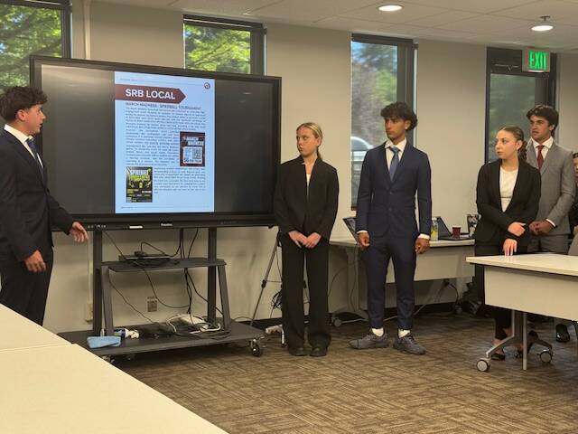 Mercer Trade Inc.s Max Laban, Chloe Simpson, Elan Gotel, Sean Kern and Quinn Harper present the classs annual report on June 10. Courtesy photo