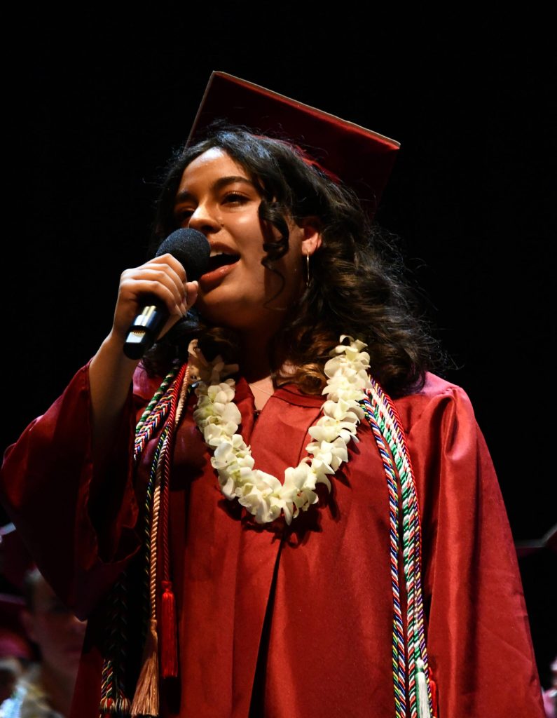 Anahita Najafian sings the National Anthem. Andy Nystrom/ staff photo