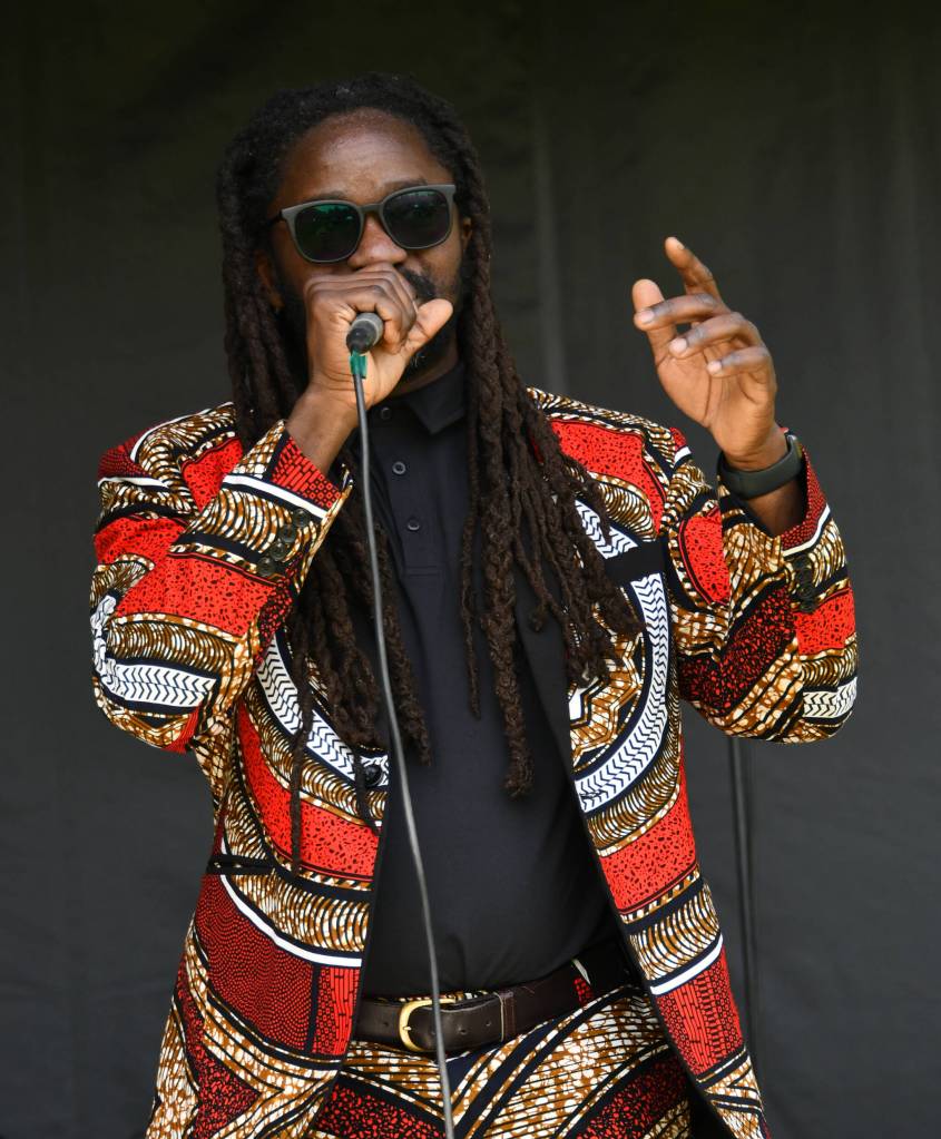 Simon Javan Okelo leads his One Vibe Band at the Mercer Island Juneteenth Community Celebration on June 19 at Mercerdale Park. Andy Nystrom/ staff photo