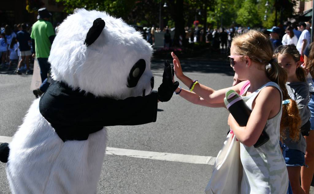 A high five from the Mercer Island Chinese Association mascot. Andy Nystrom/ staff photo