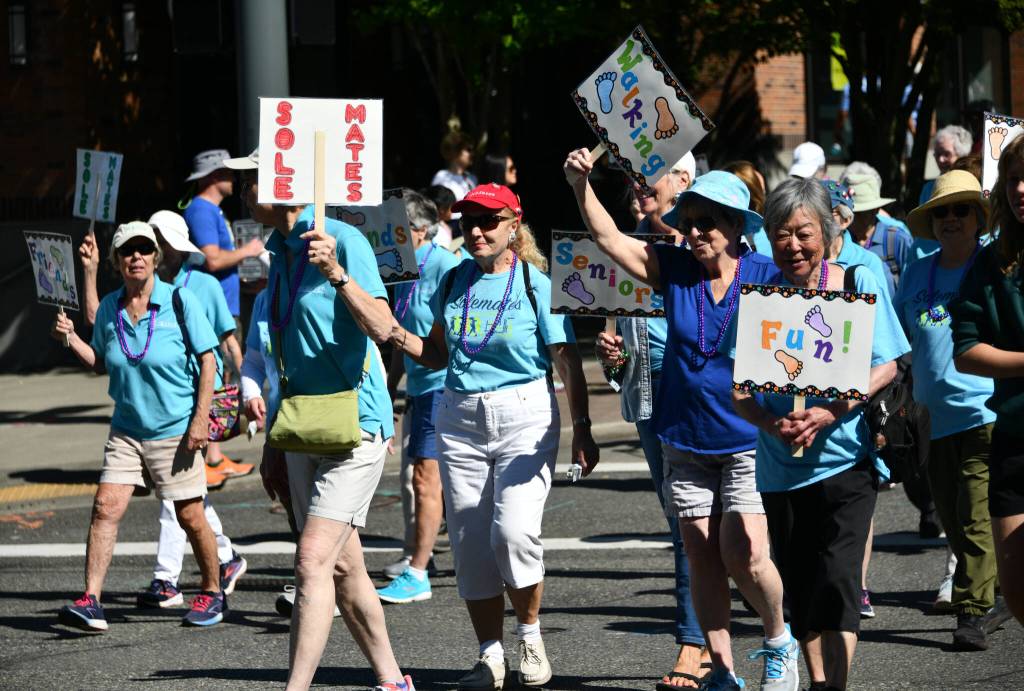 Solemates walkers take to the street. Andy Nystrom/ staff photo
