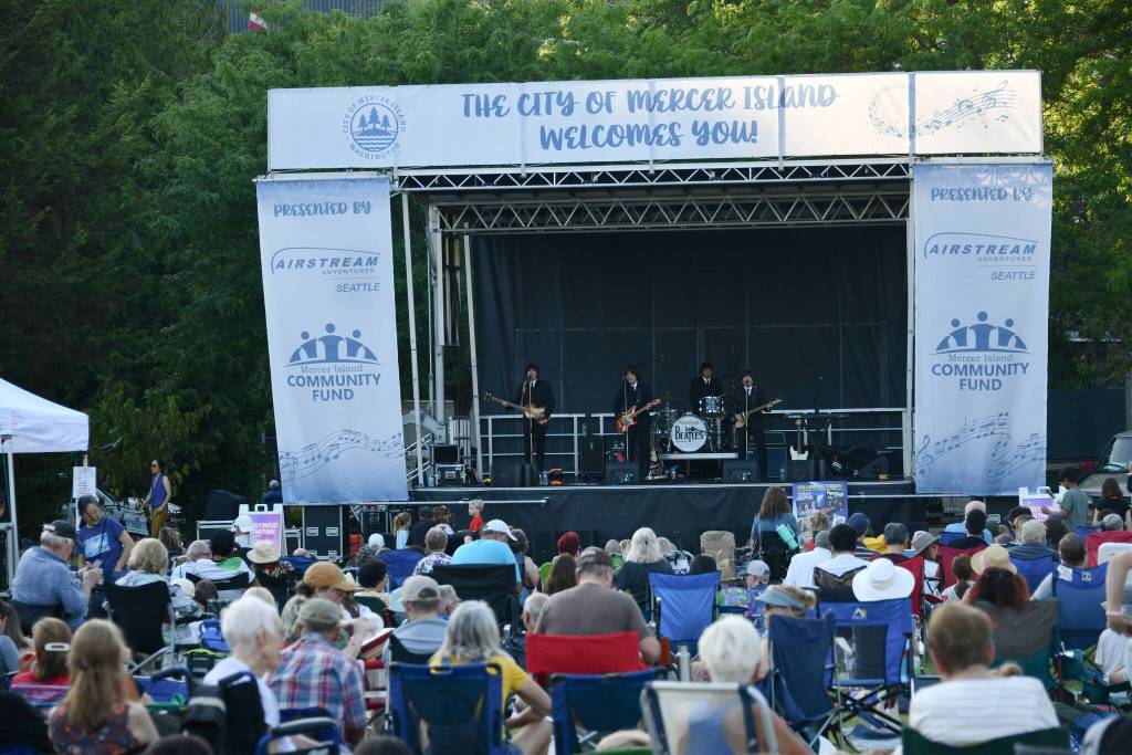 Paperback Writer entertains the Mostly Music in the Park crowd. Andy Nystrom/ staff photo