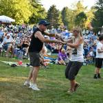 Dancers groove to the sounds of Paperback Writer, a Beatles tribute band, on July 17 at Mercerdale Park. Andy Nystrom/ staff photo