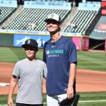 Kade Anderson and his brother Carter during Mariners batting practice. Photo by Ben Ray / Sound Publishing