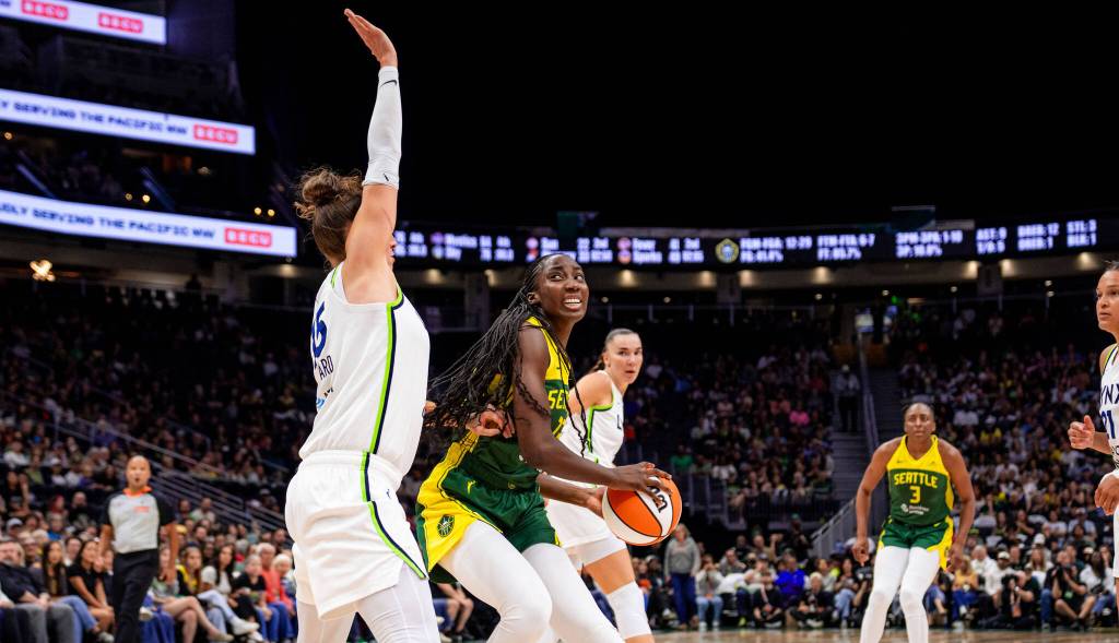 Seattle Storm Center Ezi Magbegor turns against a Lynx defender. Photo courtesy of Seattle Storm.