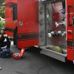 Eastside Fire & Rescues Jace Hinesly discusses his job with Mercer Island residents Nidhi Chappell and her sons, Davin and Aaron. Andy Nystrom/staff photo