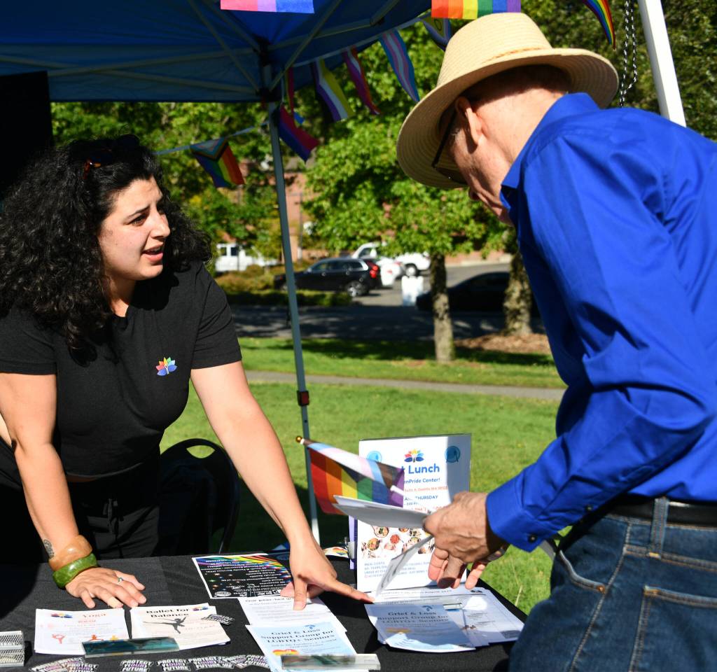 GenPride outreach and education coordinator Pamela Nassar Altabcharani chats with a Pride in the Park attendee. Andy Nystrom/ staff photo