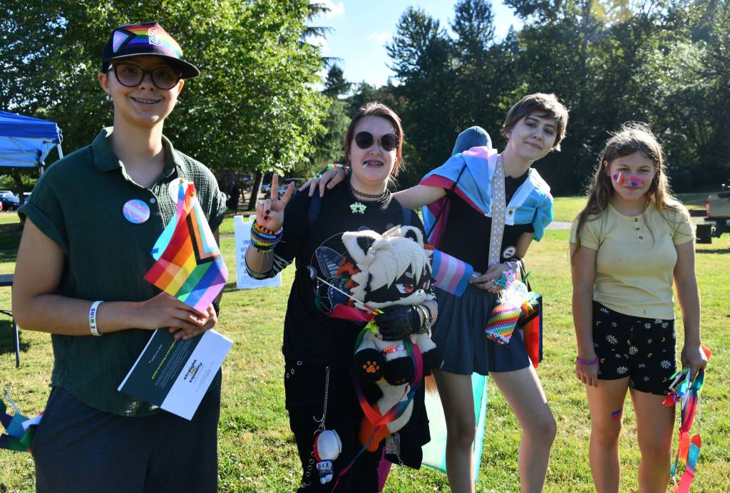 From left to right, Emily (last name withheld), V Bensen, Phoenix Miller and Jade Tracey at Mercer Islands Pride in the Park event on Aug. 7 at Mercerdale Park. Andy Nystrom/ staff photo